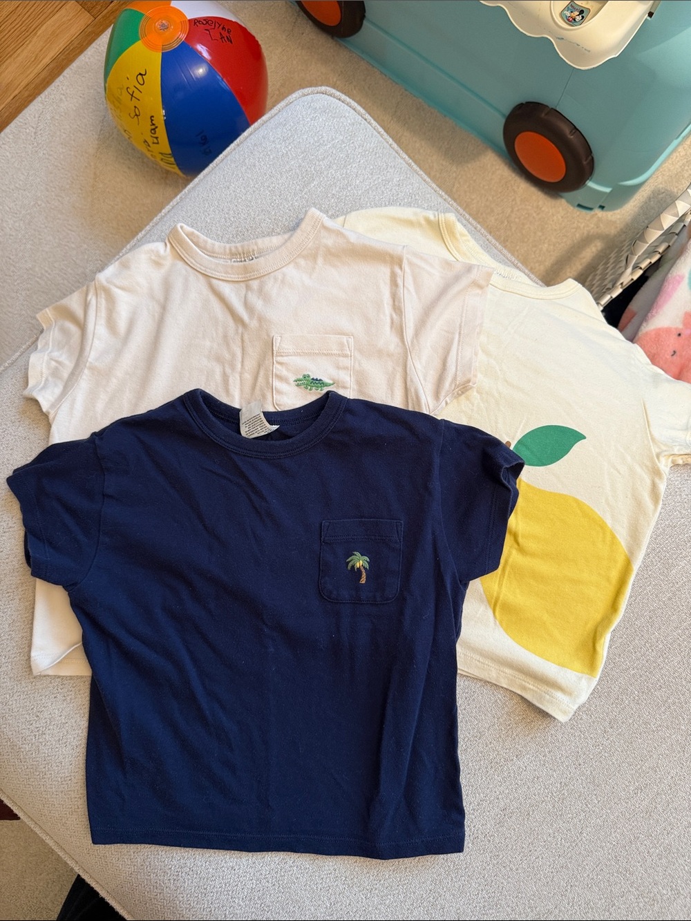 3 pieces Uniqlo Kids Short-Sleeve Pocket Tees in Navy and Cream